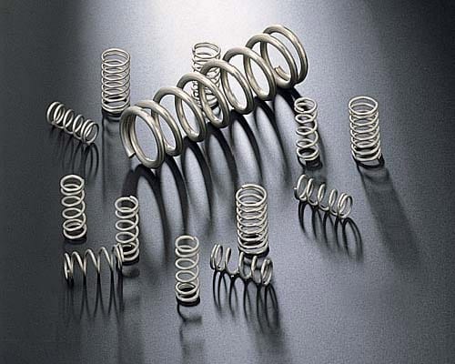Coil springs used to evaluate tangling and part-to-part contact in mass finishing